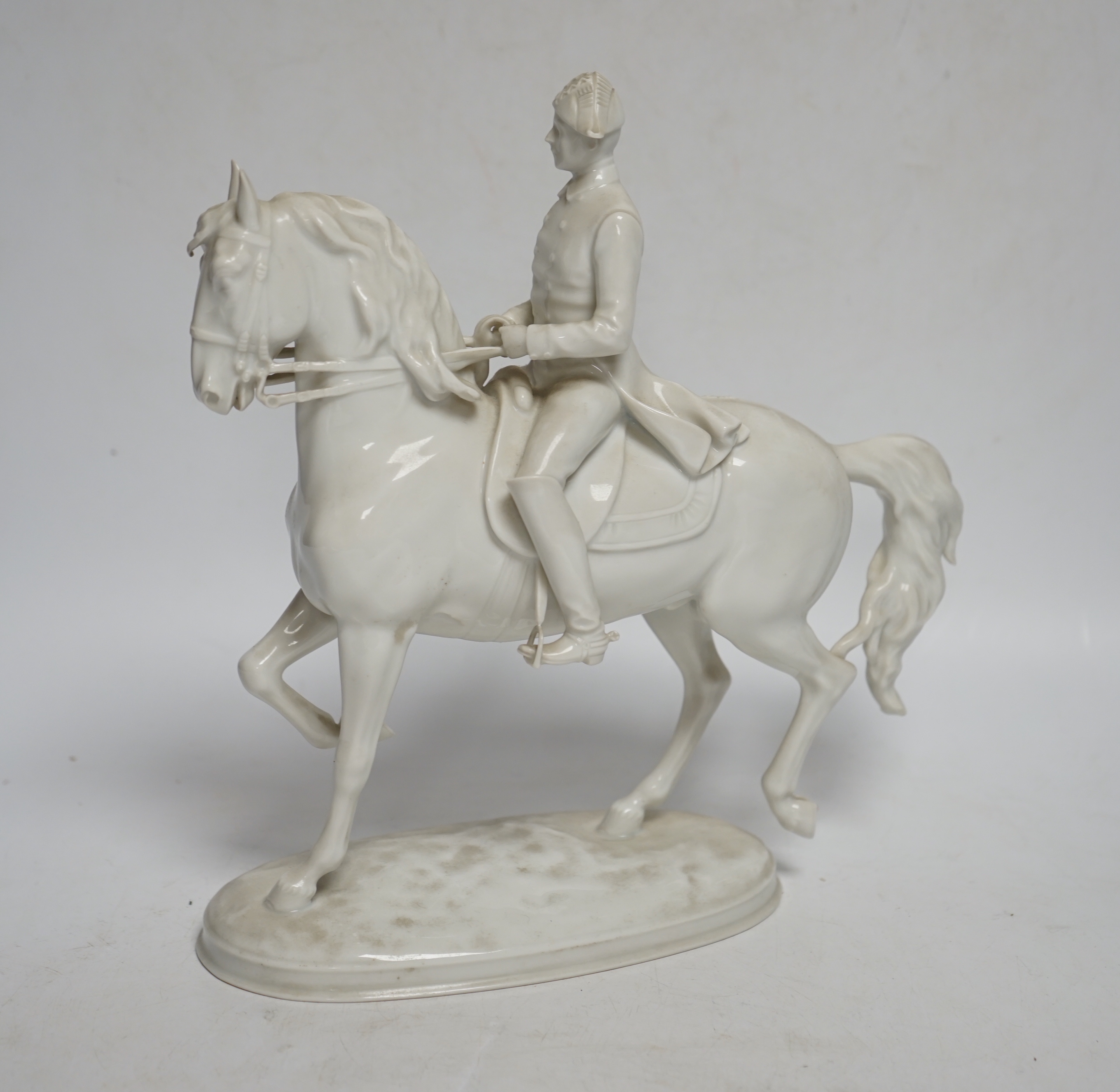 An Augarten, Wien white glazed porcelain Spanish Riding School Group, 24cm